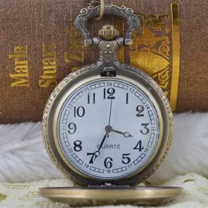 Vintage bronze quartz pocket watch with intricate floral carving dial and classic Arabic numerals.