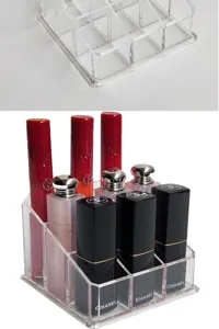 Clear acrylic lipstick organizer detail shot, multi-grid tiered makeup storage stand.
