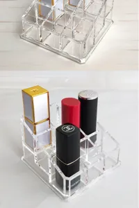Closeup view of the clear acrylic lipstick organizer showing multi-grid stepped storage compartments.