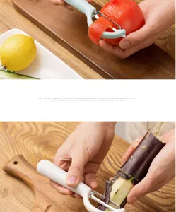 Kitchen fruit vegetable peeler detail view showing stainless steel rotating blade in action.