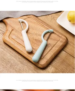 Household kitchen multi-functional fruit vegetable peeler with rotating stainless steel blades
