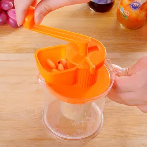 Mini presse-agrumes manuel portable en plastique avec manivelle pour fruits et legumes