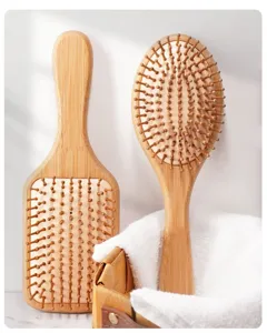 Bambus Haarbürsten Set mit Luftpolster und Massageborsten für sanfte Haarpflege.