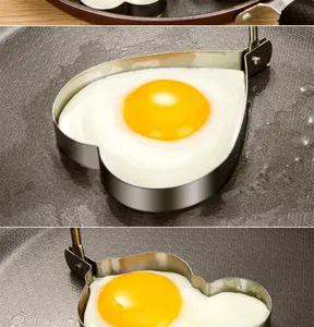 Stainless steel egg ring mold set for frying heart-shaped eggs in kitchen detail view.