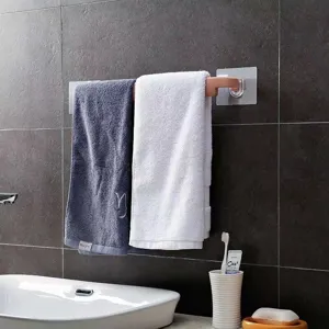 Wall-mounted towel rack punch-free bathroom storage holder for hanging towels and daily essentials.