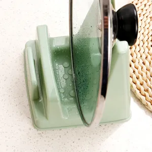 Support de couvercle de casserole et de planche à découper en plastique pour cuisine.