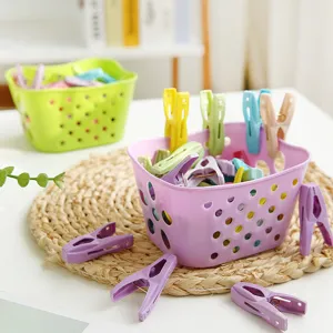 Multi-functional plastic clothes peg clip set with storage basket for home laundry drying use