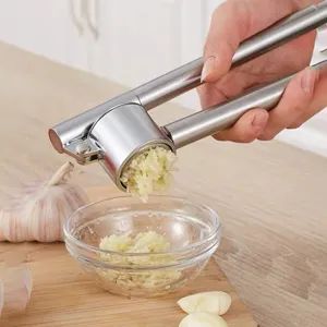 Stainless steel garlic press manual kitchen tool for effortlessly mincing fresh garlic cloves.