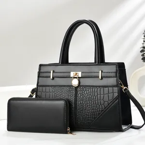 Stylish black women's handbag set with embossed texture and metal lock detail for daily wear.