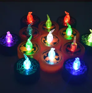 Halloween LED tea light candles, glowing pumpkin and spider web designs, colorful party decor.