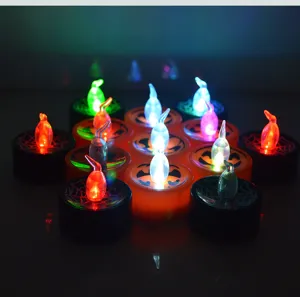 Halloween LED tea light candles, glowing pumpkin and spider web plastic ornaments for spooky party decor.