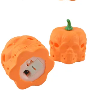 Halloween LED pumpkin skull glowing night light detail view with battery compartment switch.