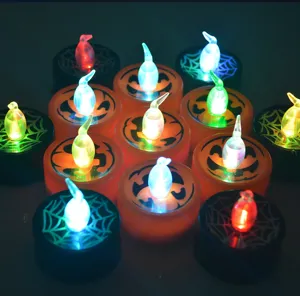 Halloween LED tea light candles with pumpkin and spider web designs for spooky party decor.
