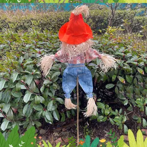 Halloween scarecrow decoration outdoor garden ornament with orange hat and plaid shirt detail.