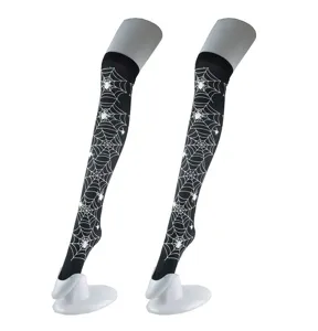 Detail shot showing the intricate white spider web pattern on the black over-the-knee socks.