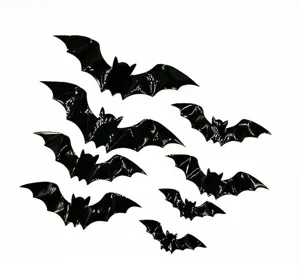 Detail view of glossy black 3D bat wall stickers, perfect for Halloween window and party decor.