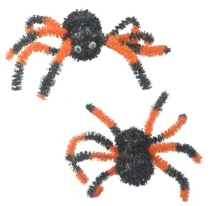 Halloween spider decoration detail, black and orange fuzzy plush prop for party setup.