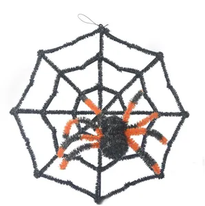 Halloween hanging spider web decoration set featuring a detailed black and orange plush spider prop.