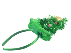 Christmas tree headband detail, green tinsel and gold star decoration for holiday party.