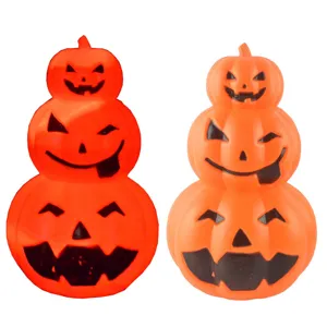 Halloween stacked light up pumpkin lantern glowing jack o lantern decor for party setup.