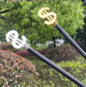 Dollar sign scepter prop detail view, featuring gold and silver toy wand for costume party.