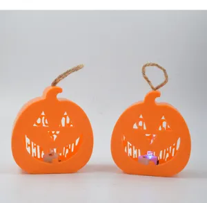LED Halloween pumpkin candle light with hanging rope, hollow carved festive party decor detail.