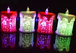 Christmas LED electronic candle night light desktop ornament with Santa Claus hollow design.