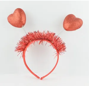 Red glitter heart headband with tinsel for Valentine's Day party hair decoration accessory.