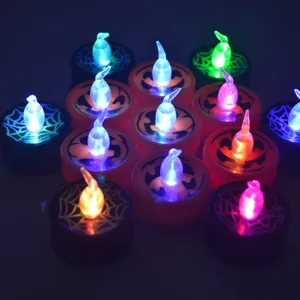 Halloween LED electronic tea light candles set with colorful glowing ghost flame and pumpkin face.
