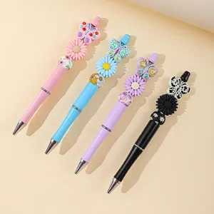 Colorful silicone beaded ballpoint pens with decorative butterfly and daisy charms set.