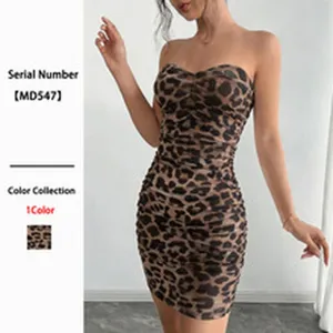 Close-up detail of a sexy leopard print bodycon mini dress with off-the-shoulder design.