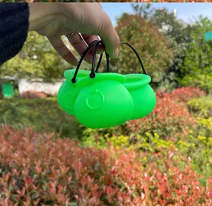 Green mini plastic cauldron buckets with handles for St. Patricks Day party decorations.
