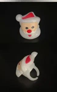 Christmas Santa Claus flashing LED ring for kids, festive cartoon party toy gift accessory.