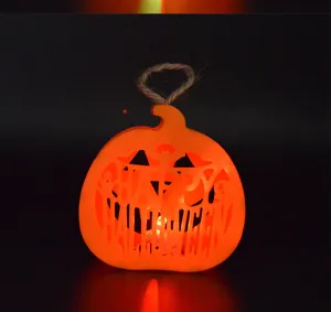 LED pumpkin light detail, hollowed design with Happy Halloween text and rope handle for parties.