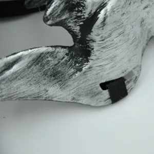 Halloween skull warrior mask detail shot, black and white distressed finish with elastic strap.