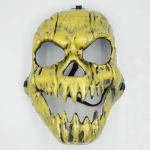 Detailed view of the yellow and black Halloween skull mask, featuring sharp teeth design.