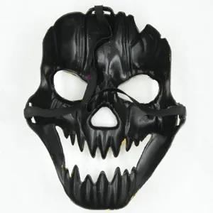 Detailed view of black Halloween skull mask with sharp teeth and elastic strap for party.