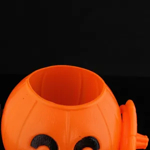 Halloween orange plastic pumpkin bucket close-up, smiling face design, detail view for decor.