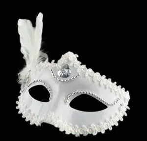 White masquerade mask with elegant feathers, lace trim and seashell decor for party.