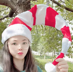 Extra-long plush Christmas hat, red and white striped adult holiday costume accessory.