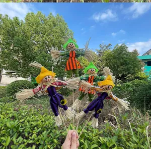 Halloween decorative scarecrow stake detail, perfect for autumn floral arrangement and DIY craft project.