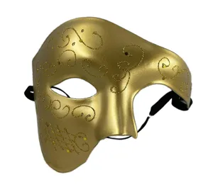 Détail du masque de bal masqué doré, demi-masque rétro peint du fantôme de l'opéra à paillettes.