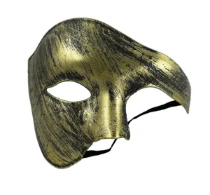 Masque de bal masqué demi-visage doré noir vintage, détail accessoire costume fantôme.