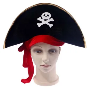 Pirate hat detail showing black velvet, gold trim, white skull emblem and red ribbon for Halloween.