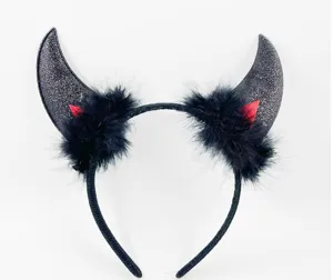 Halloween devil horn headband detail view, featuring black glitter horns and fluffy feathers.