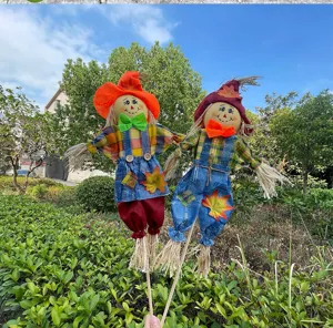 Handmade autumn scarecrow doll decoration for garden yard and kindergarten holiday party decor.