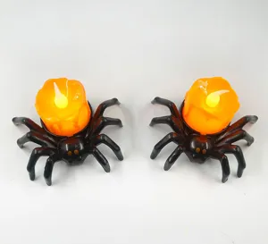 Halloween spider LED candle lights close-up view, glowing orange flame decoration for party use.