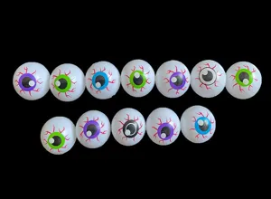 Close-up of plastic Halloween fake eyeballs with colorful irises and red blood vessel details.