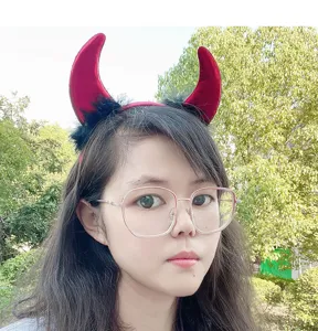 Red devil horn headband with black feathers, perfect for Halloween and party costume decoration.
