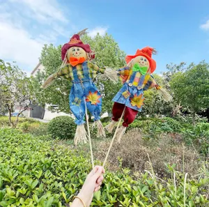 Autumn harvest scarecrow garden stake decorations, cute handmade straw dolls for autumn.